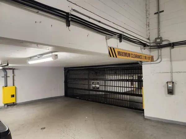 Commercial parkade security grille in an underground strata parkade